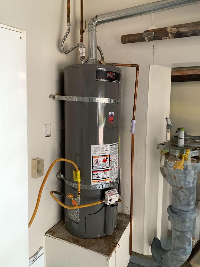United Plumbing pro replacing a hot water heater in an East Palo Alto home