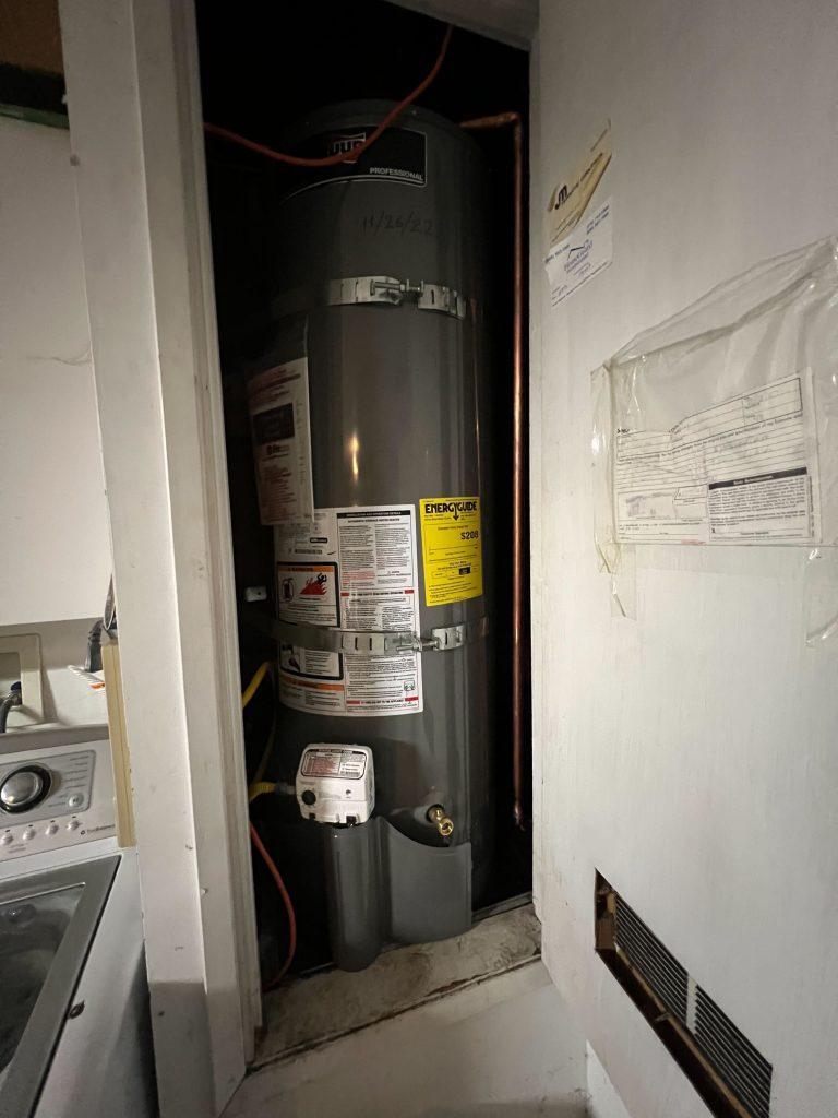 A plumber inspecting a water heater in Hillsborough | United Plumbing