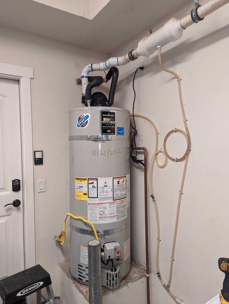 A professional plumber installing a 50 gallon water heater in Menlo Park | United Plumbing