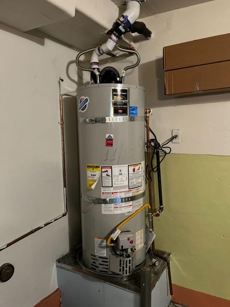 A professional plumber installing a 50-gallon water heater in Redwood City | United Plumbing