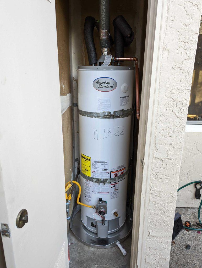 A plumber inspecting a water heater in San Bruno | United Plumbing