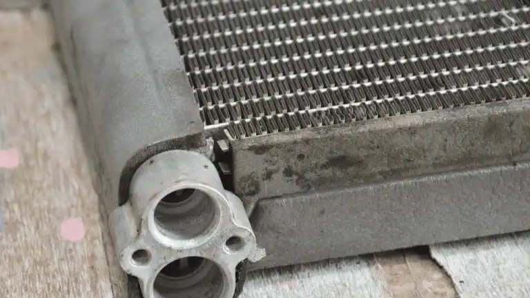 Clogged and dirty AC evaporator coil causing air conditioner not blowing cold air.