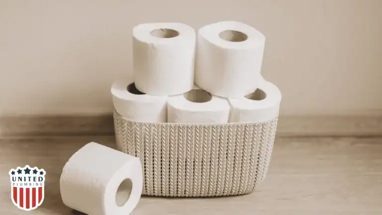 Multiple toilet paper rolls stacked in a basket, highlighting how excessive toilet paper use can lead to toilet clogs.
